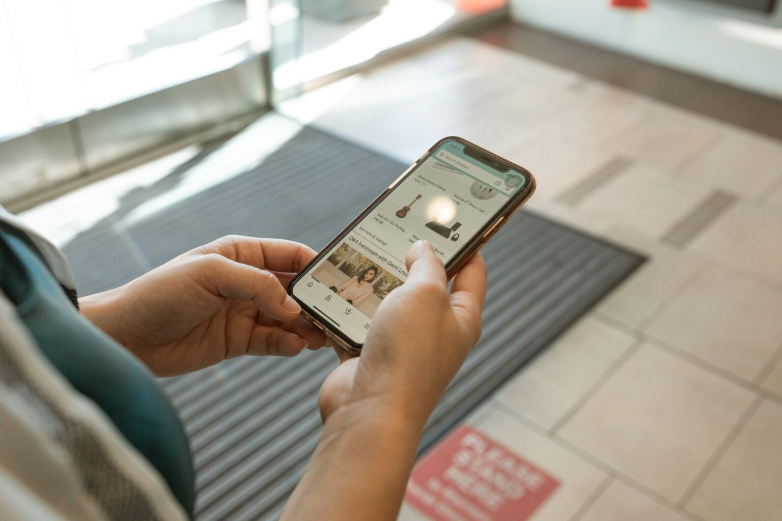 Person browsing a shopping app on a smartphone representing Instagram e-commerce behavior