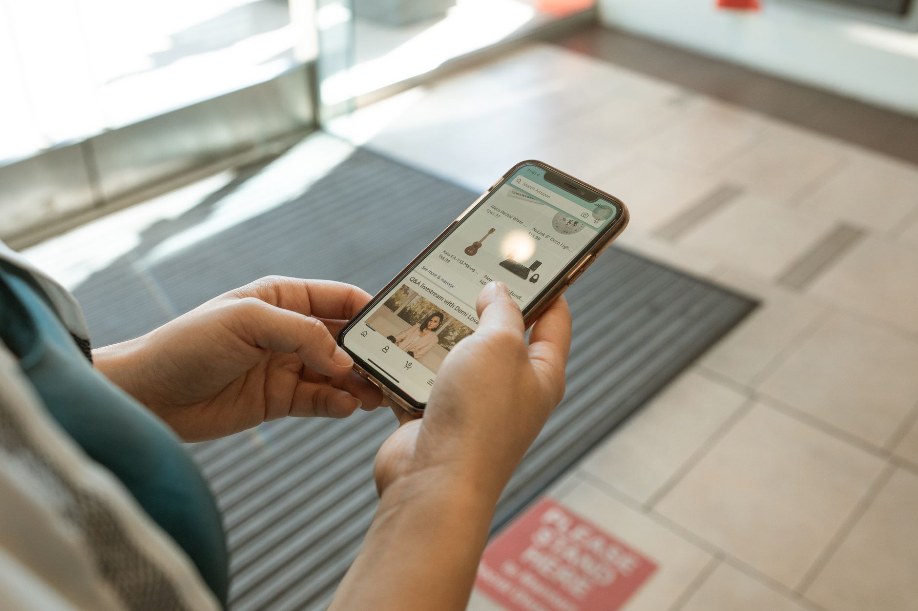 Person browsing a shopping app on a smartphone representing Instagram e-commerce behavior