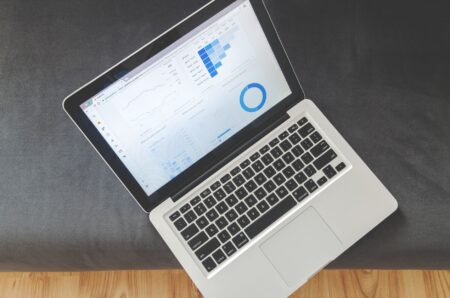 Person reviewing content analytics dashboard on a laptop screen