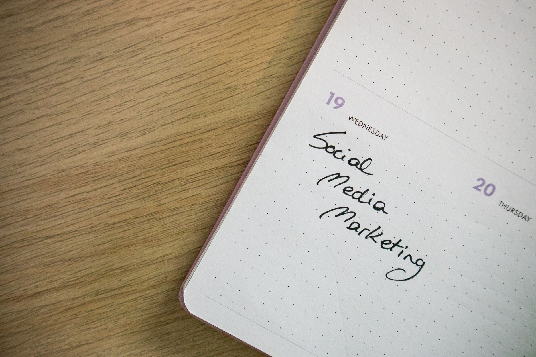 Content calendar and planning documents spread across a modern desk workspace