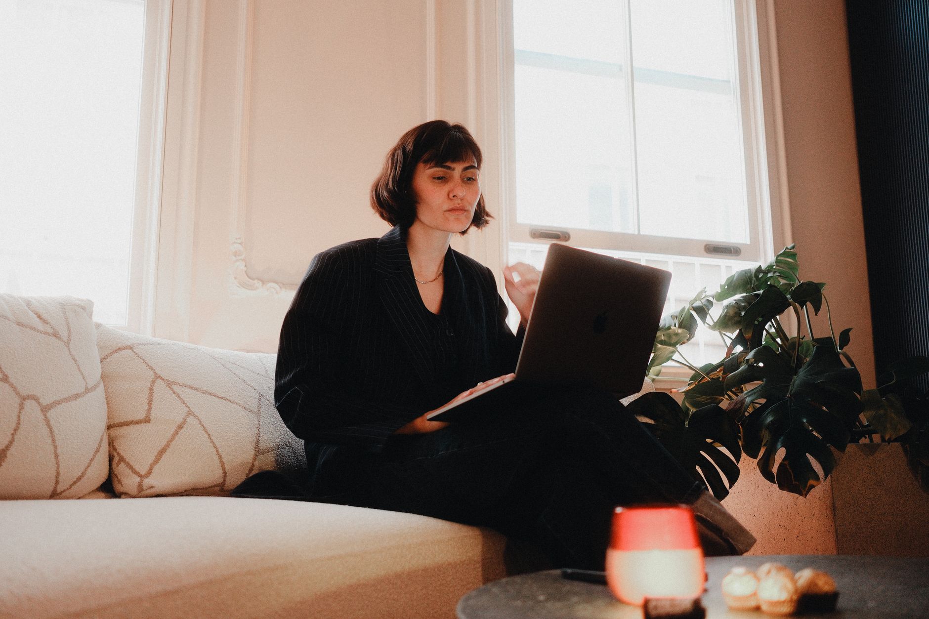 Social media manager reviewing client reports on a laptop