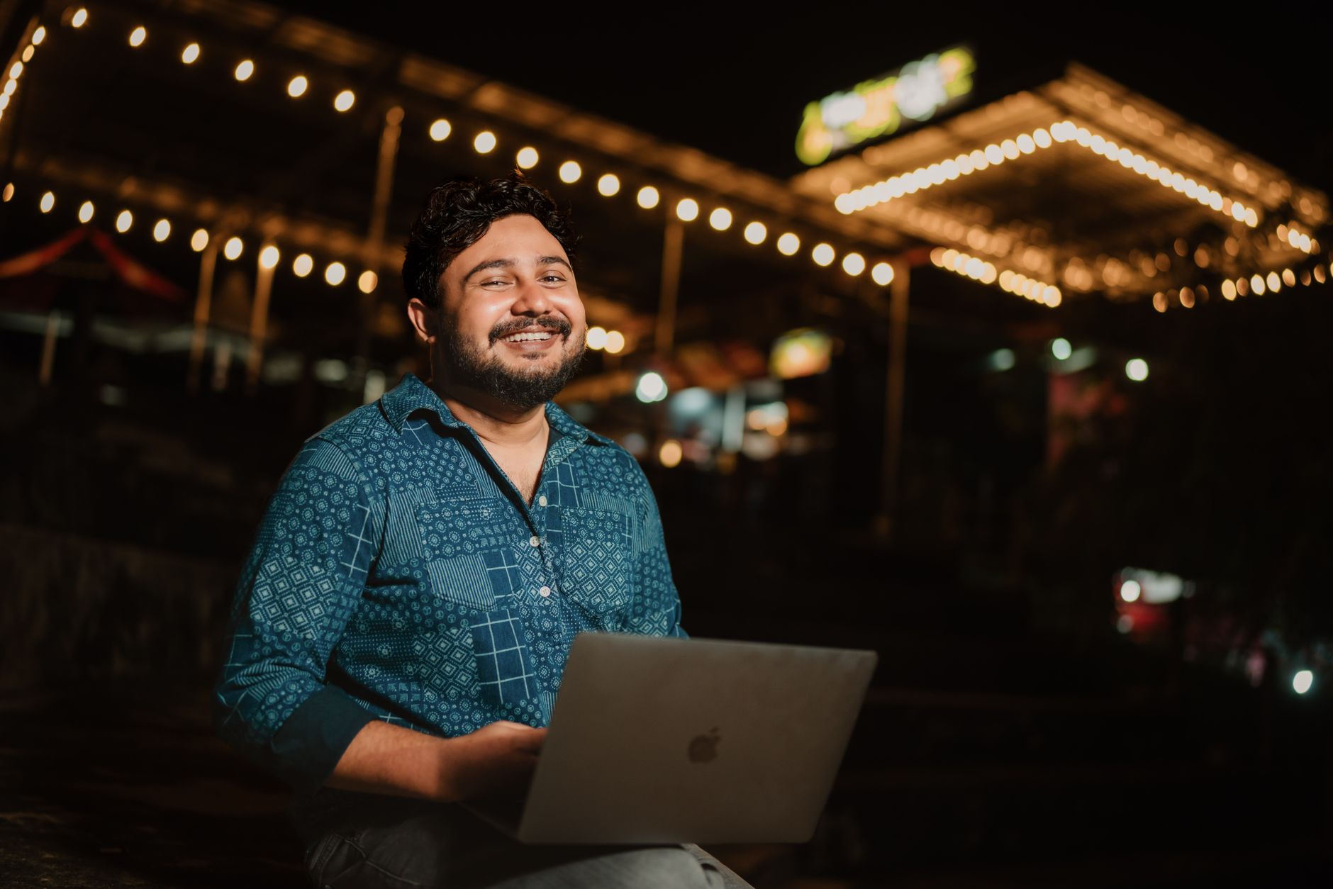 Content creator working on a laptop reviewing social media video clips