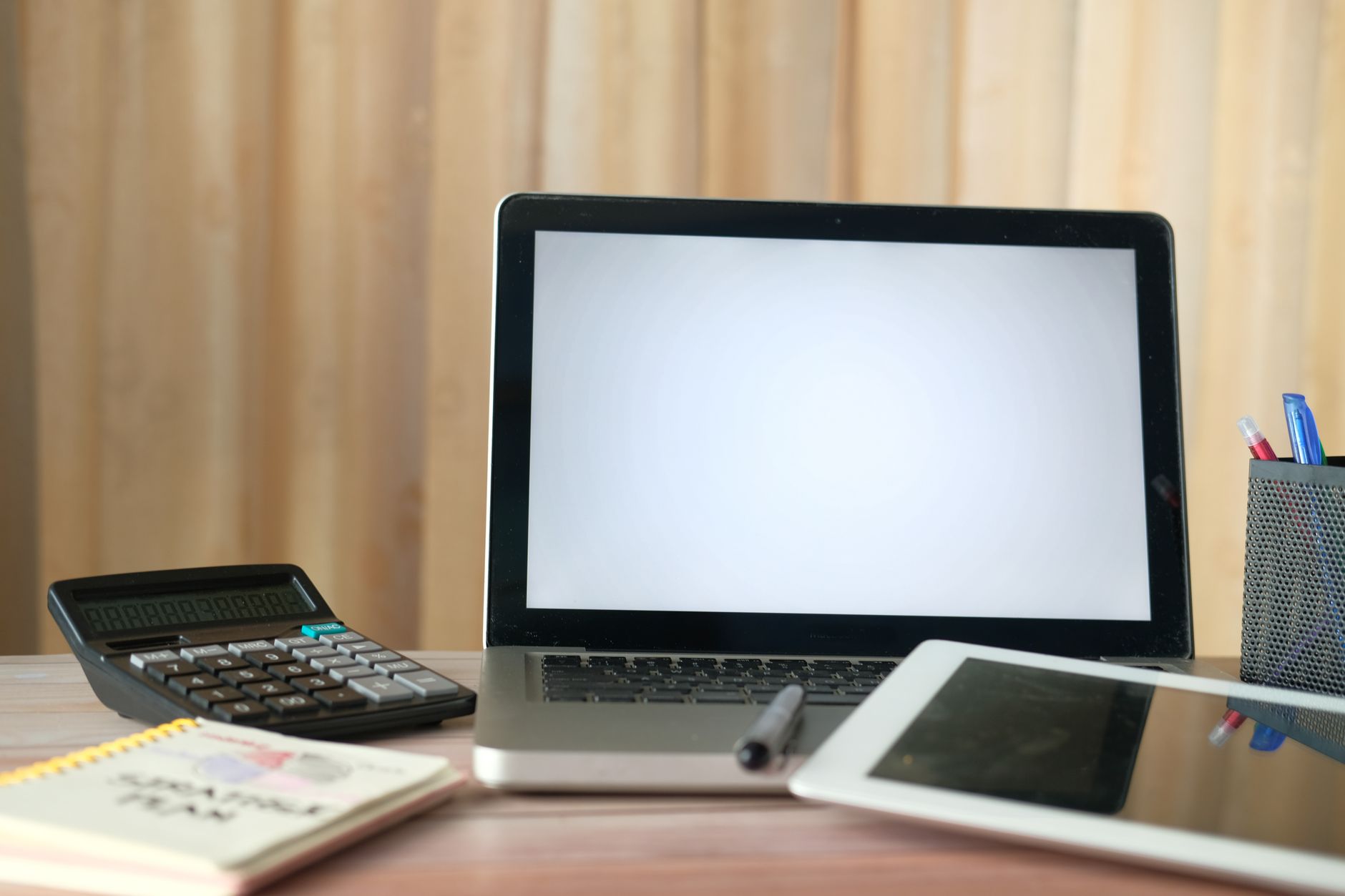 Modern workspace with multiple screens showing digital marketing tools