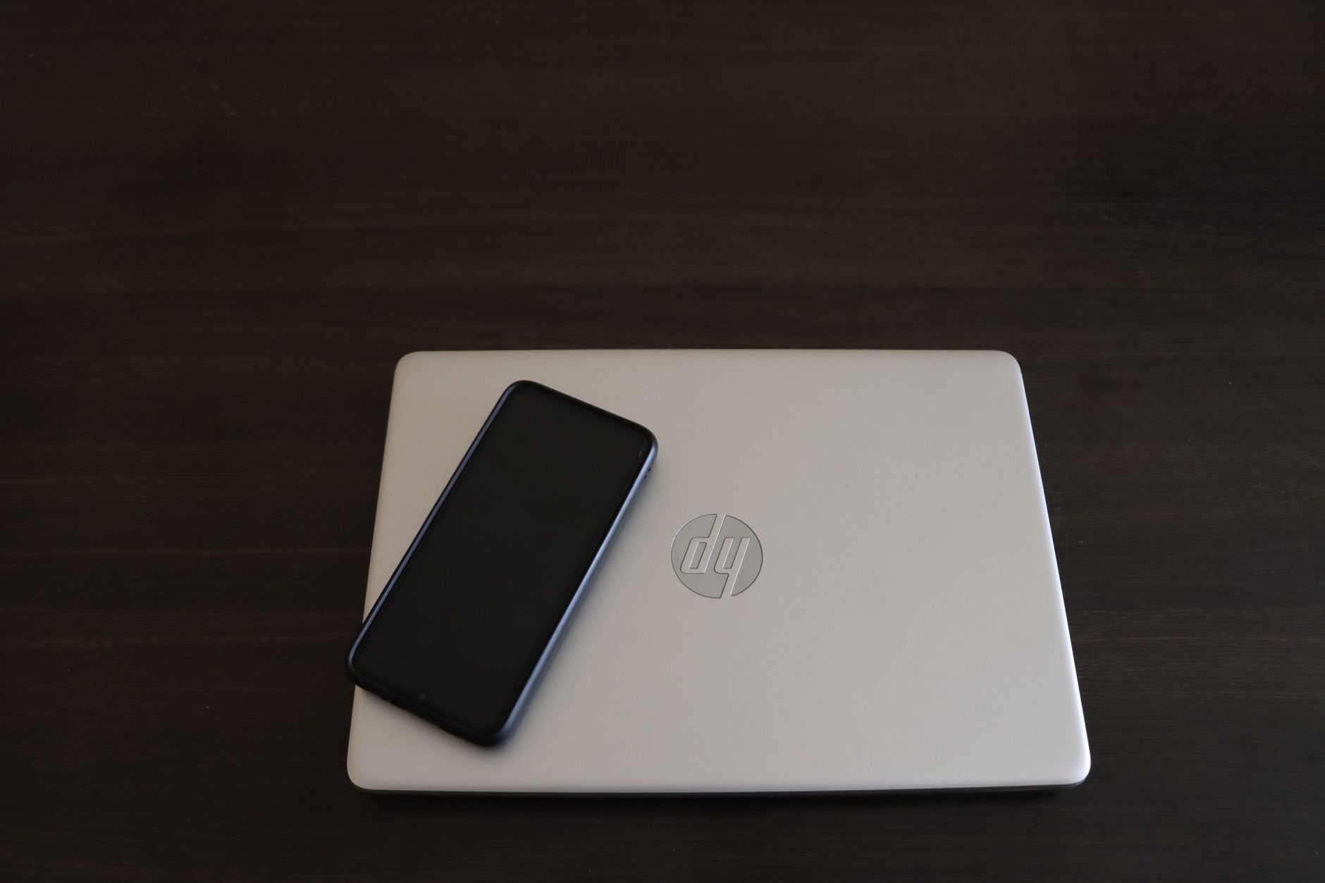 Clean desk workspace with laptop open showing a productivity application